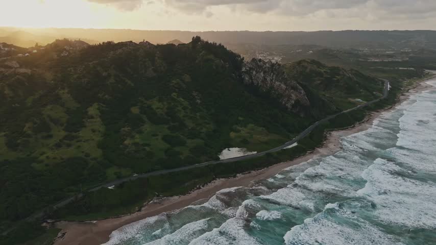 Puerto Rico Atlantic Coastline at Sunset with Waves and Coastal Hills Aerial