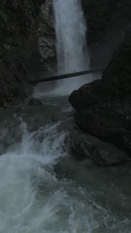 Cascade Falls cascading through a forested canyon in Mission, BC — aerial view