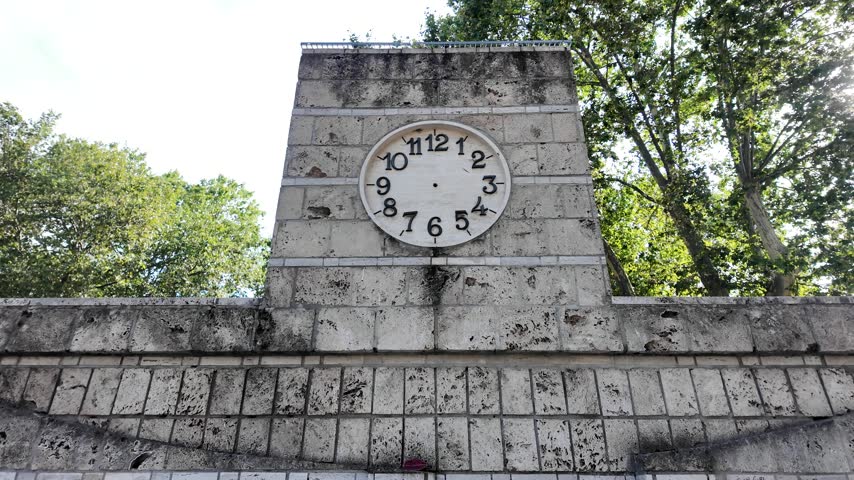 Stone Clock Monument In Nicola Calipari Gardens At Piazza Vittorio Emanuele II In Rome