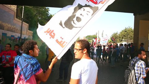 CAIRO, EGYPT - 2013: Demonstrators wave homemade banners in Cairo, Egypt