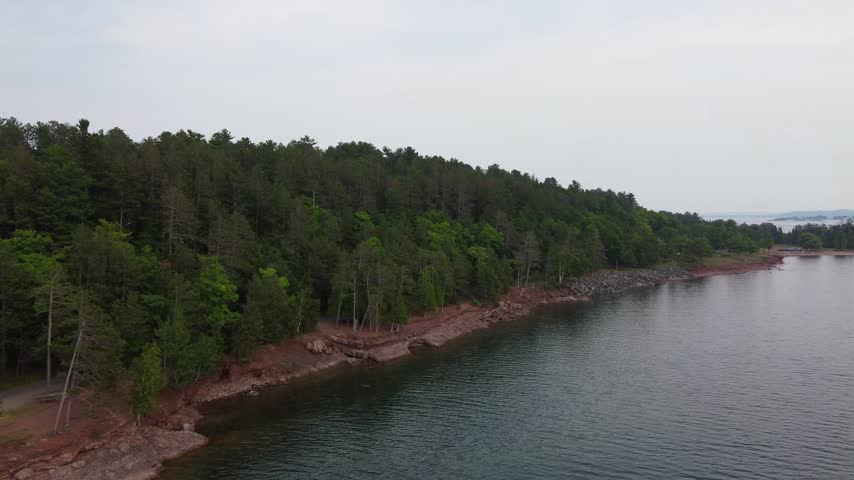 Slow approach Aerial just outside Presque Isle Park in Marquette Michigan. Beautiful landscape on the shores of Lake Superior.