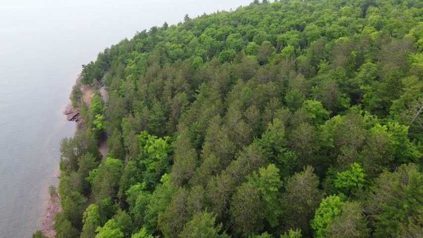 Slow Birds Eye Aerial just outside Presque Isle Park in Marquette Michigan. Beautiful landscape on the shores of Lake Superior.