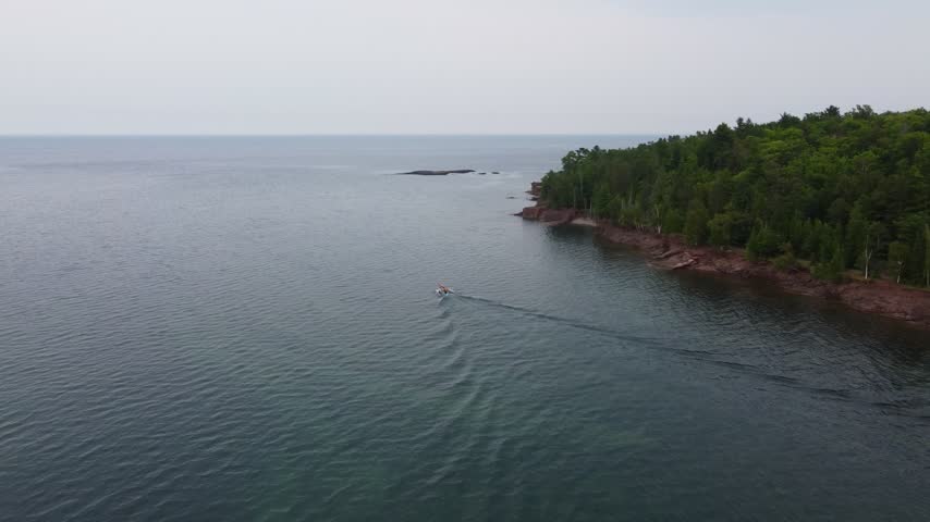  Boat follow Aerial just outside Presque Isle Park in Marquette Michigan. Beautiful landscape on the shores of Lake Superior.