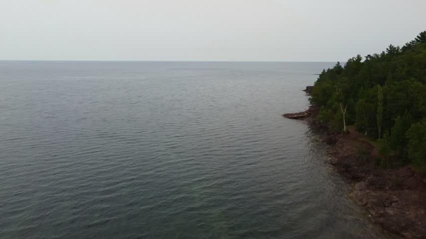 Low Turning Aerial just outside Presque Isle Park in Marquette Michigan. Beautiful landscape on the shores of Lake Superior.