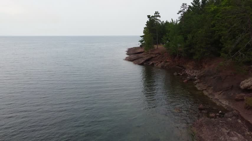 Low approach Aerial just outside Presque Isle Park in Marquette Michigan. Beautiful landscape on the shores of Lake Superior.
