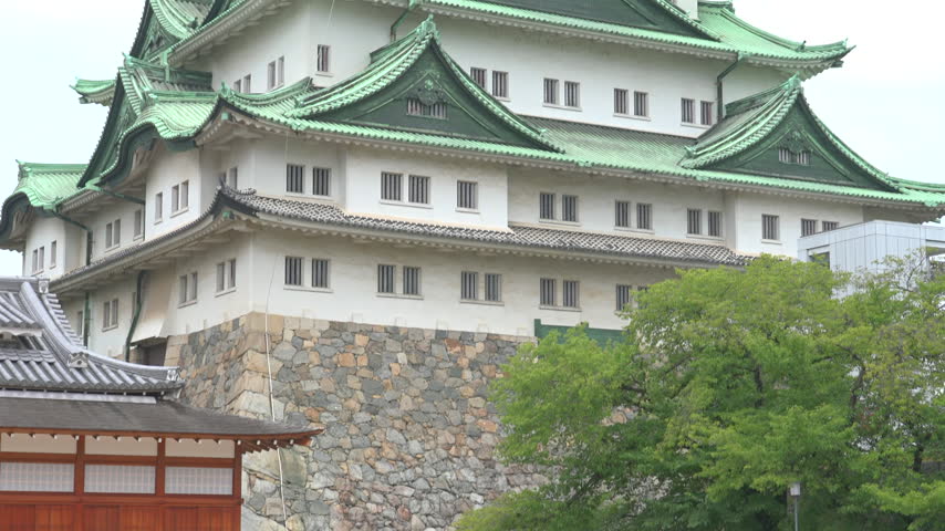 Main keep of Nagoya Castle with green copper roofs and golden shachihoko Japan