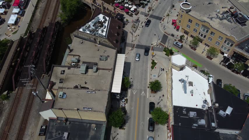 Dynamic Birdseye Aerial Village of Wauwatosa Wisconsin in the Milwaukee region. Restaurants on the river.	