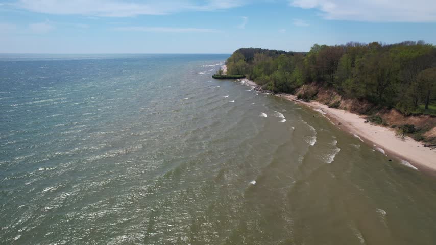 
Slow approach along coast Aerial of Silver Creek Park in Manitowoc Wisconsin on the Shore of Lake Michigan