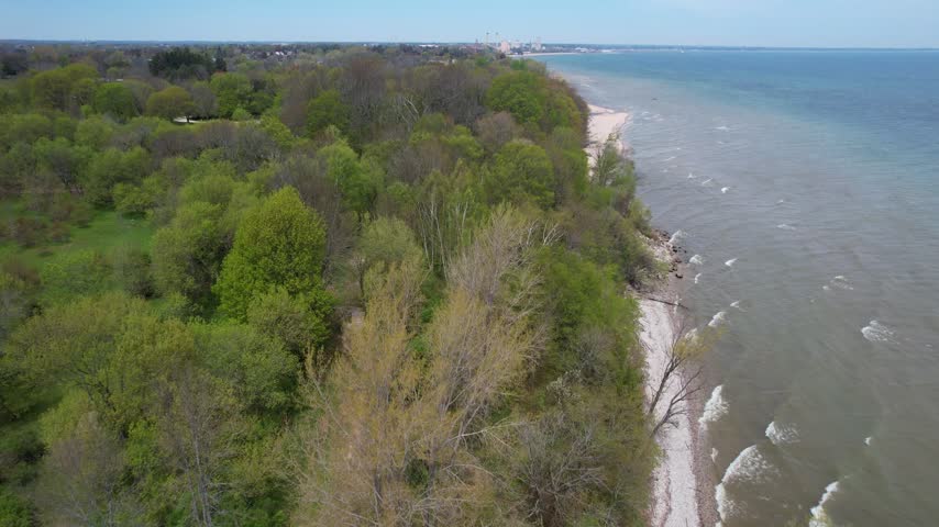 
Low Tree Line Aerial of Silver Creek Park in Manitowoc Wisconsin on the Shore of Lake Michigan