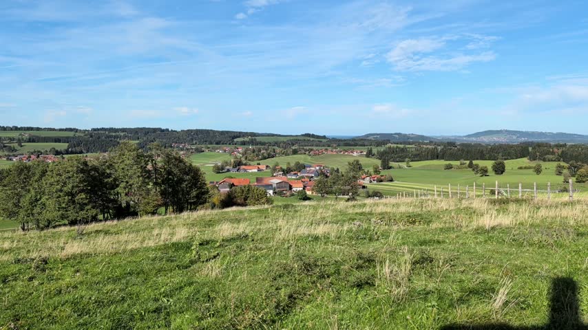 Peaceful village of Wildsteig in Oberbayern surrounded by green meadows in Bavaria, ideal for rural tourism