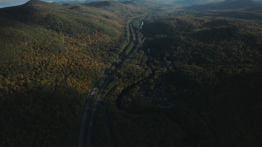 Aerial view of the highway running through the Adirondack Mountains. Shot on an autumn day in New York State.