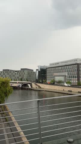 Berlin city center modern buildings near Spree river panoramic view in a moody cloudy day. Everyday life of German capital, Berlin architecture