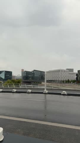 Berlin city downtown modern buildings on Spree river bank panoramic view on a moody cloudy day. Contemporary Berlin architecture