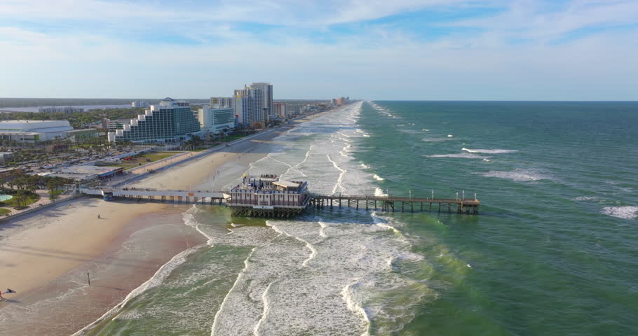 Main Street Pier in Daytona Beach, Florida, a key landmark with nearby hotels and condos forming part of the Atlantic city oceanfront landscape.