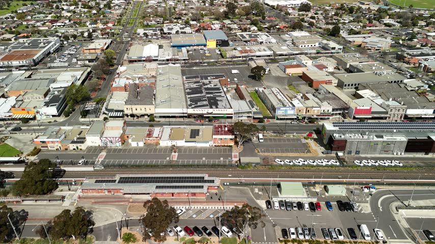Morwell, Victoria, Australia – 4K aerial drone view of Latrobe Valley regional city, traffic, shops and houses, divided roads, railway corridor, residential neighbourhoods and urban infrastructure