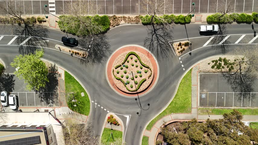 Morwell, Victoria, Australia – 4K aerial drone view of Latrobe Valley regional city, landscaped roundabouts, divided roads, traffic and urban infrastructure