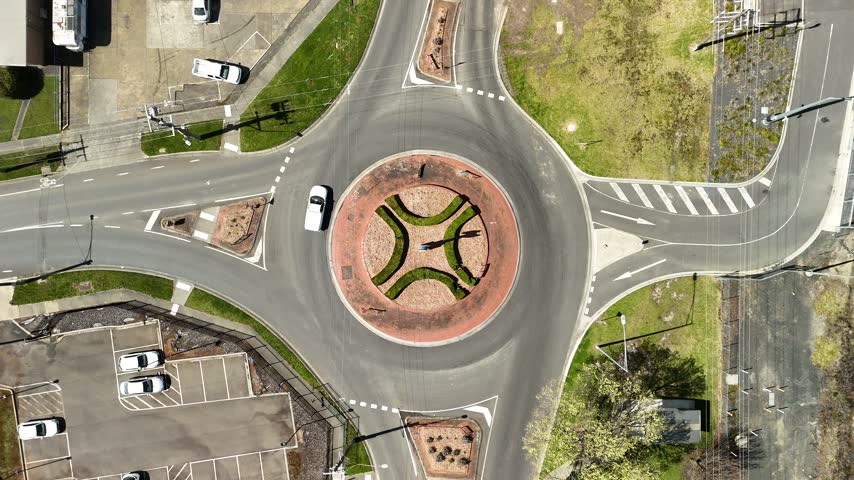 Morwell, Victoria, Australia – 4K aerial drone view of Latrobe Valley regional city, landscaped roundabouts, divided roads, traffic and urban infrastructure