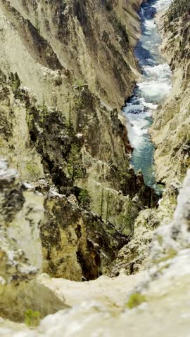 Vertical video looking down into the Grand Canyon of the Yellowstone with the turquoise river below