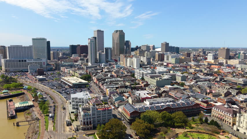 New Orleans city, Louisiana with Jackson Square in French Quarter and downtown skyscrapers. Old and new urban architecture.