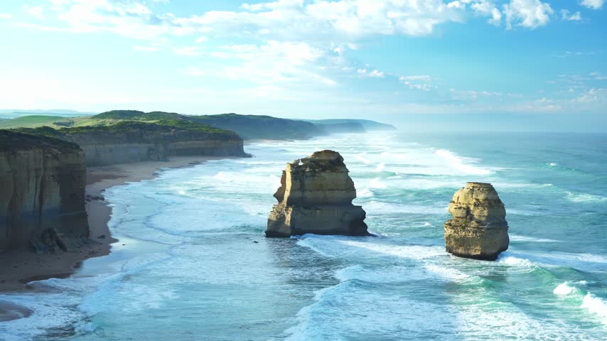 Ocean waves and limestone sea stacks at the Twelve Apostles during sunrise, Victoria, Australia