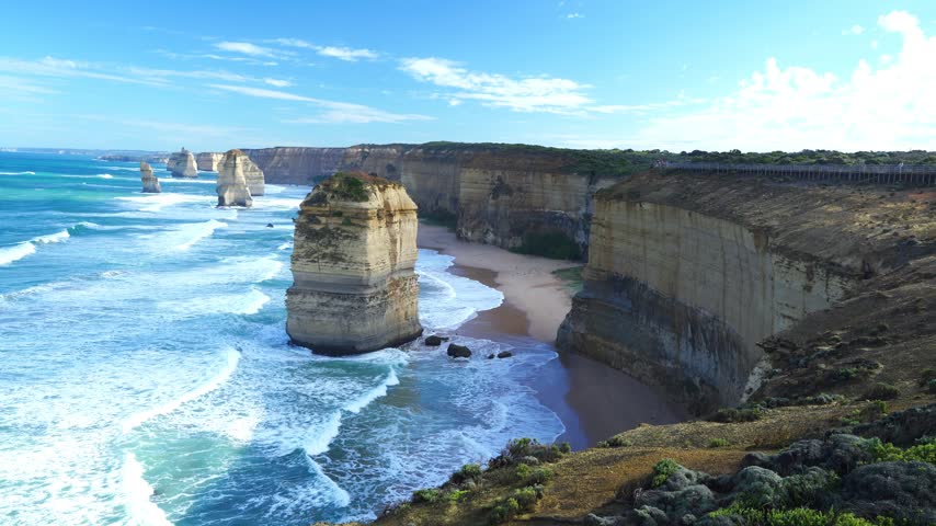 Early morning at the Twelve Apostles with golden sun rays over the sea stacks, Victoria, Australia