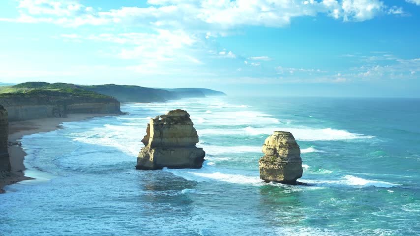 Golden sunrise light on the limestone sea stacks of the Twelve Apostles, Victoria, Australia