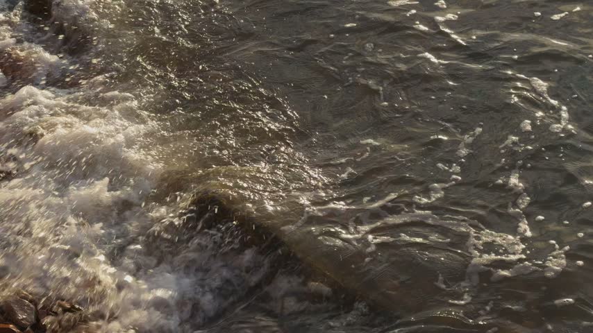 Ocean Waves Washing Over Coastal Rocks Close-Up Slow Motion 
