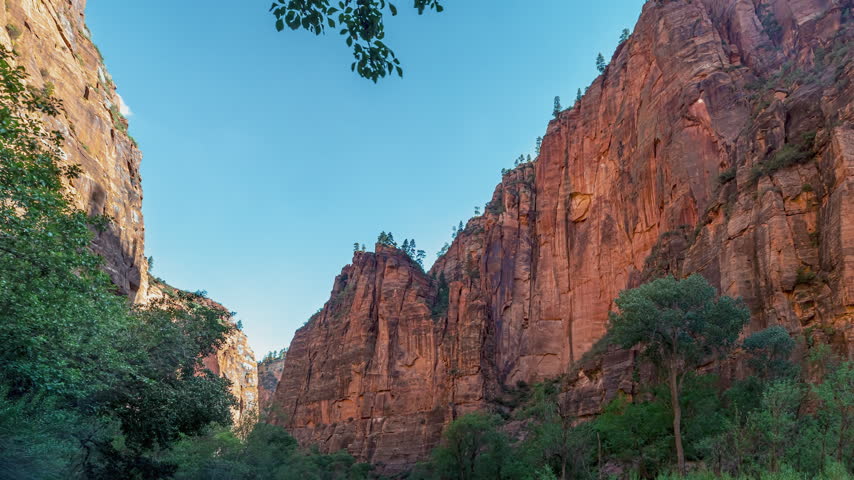 Time-lapse of zion Canyon Towering Red Rock Cliffs Landscape in Utah.