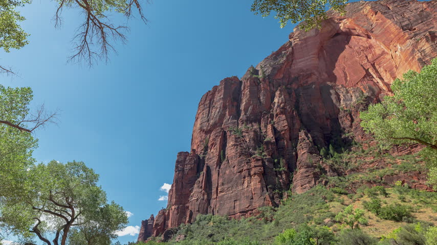 Time-lapse of zion National Park Puffy Clouds Over Red Rock Canyon Landscape Utah.