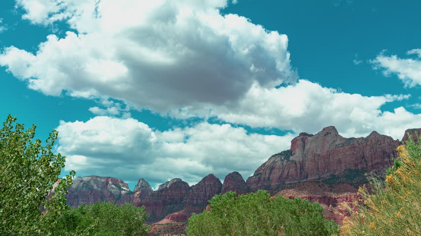Time-lapse of zion National Park Puffy Clouds Over Red Rock Canyon Landscape Utah.