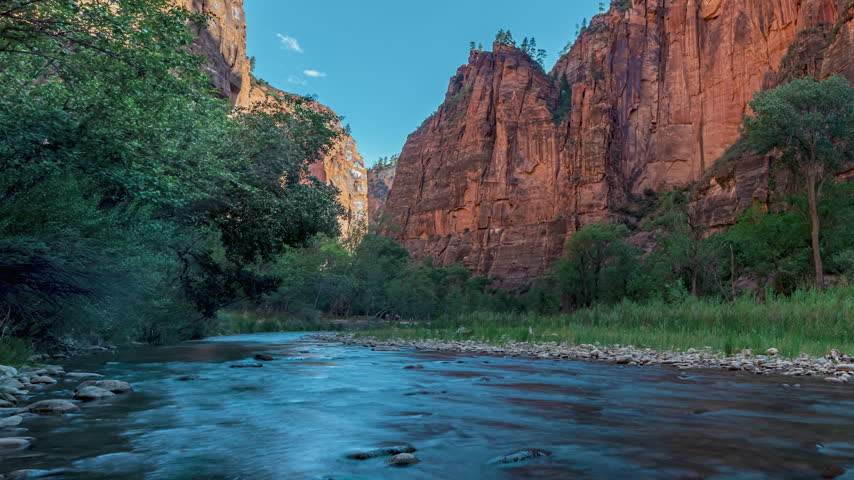 Time-lapse of towering red rock cliffs in Zion Canyon, Utah.