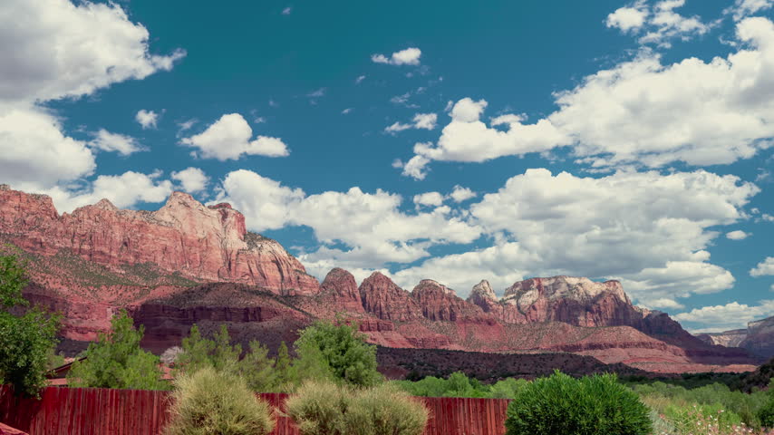 Time-lapse of zion National Park Puffy Clouds Over Red Rock Canyon Landscape Utah.