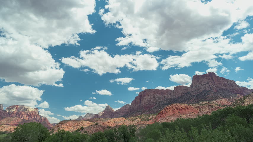 Time-lapse of zion National Park Puffy Clouds Over Red Rock Canyon Landscape Utah.