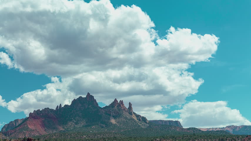 Time-lapse of zion National Park Puffy Clouds Over Red Rock Canyon Landscape Utah.