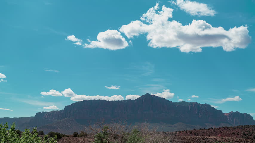 Time-lapse of zion National Park Clouds Moving Over Red Rock Canyon Utah.