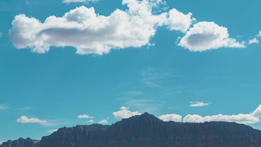 Time-lapse of zion National Park Puffy Clouds Over Red Rock Canyon Landscape Utah.
