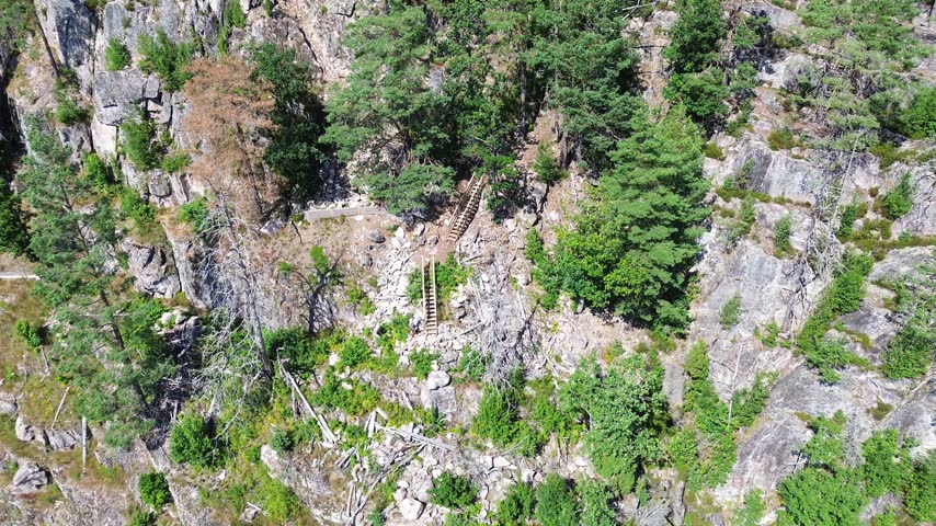 Drone View of Visitors Climbing Steep Ladders Toward Mikaelshulen Cave, Norway
