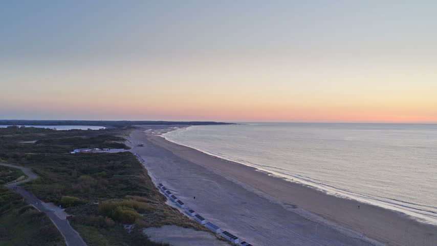 Stunning aerial drone sunset over the North Sea coast in Zeeland, Netherlands