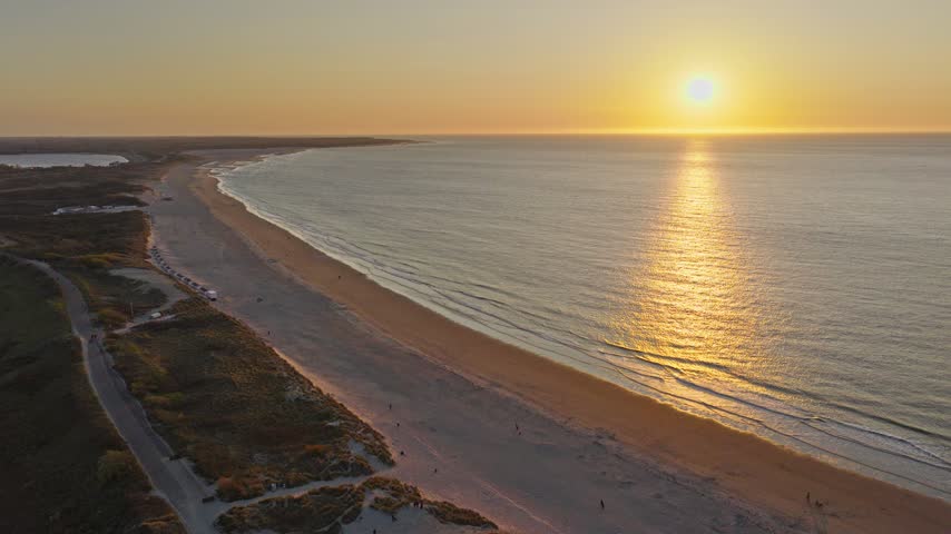Stunning aerial drone sunset over the North Sea coast in Zeeland, Netherlands