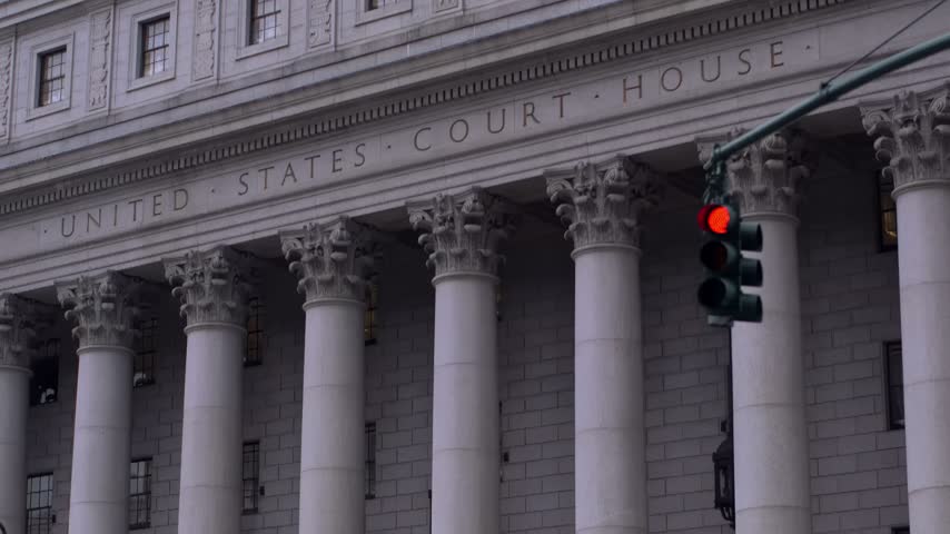 United States Courthouse Building with Classical Architecture and Red Traffic Light