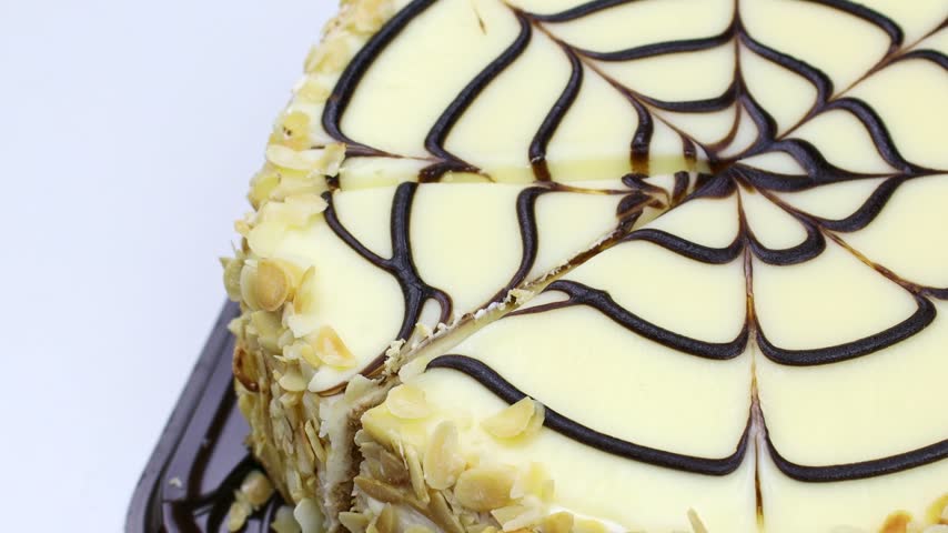 Traditional Hungarian Esterhazy cake piece cut with a knife close up
