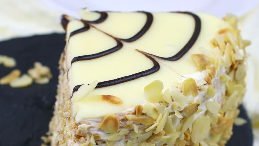 Traditional Hungarian Esterhazy cake piece cut with a knife close up