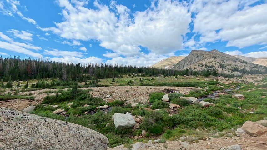 Clouds Waft Over Fields Below Lawn Lake in Rocky Mountain National Park