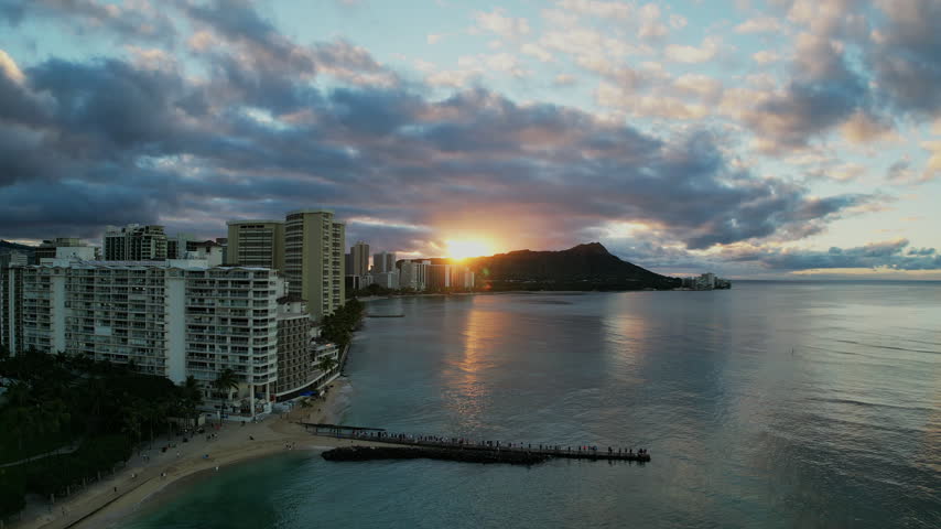 Sunset Over Honolulu Skyline and Pacific Ocean