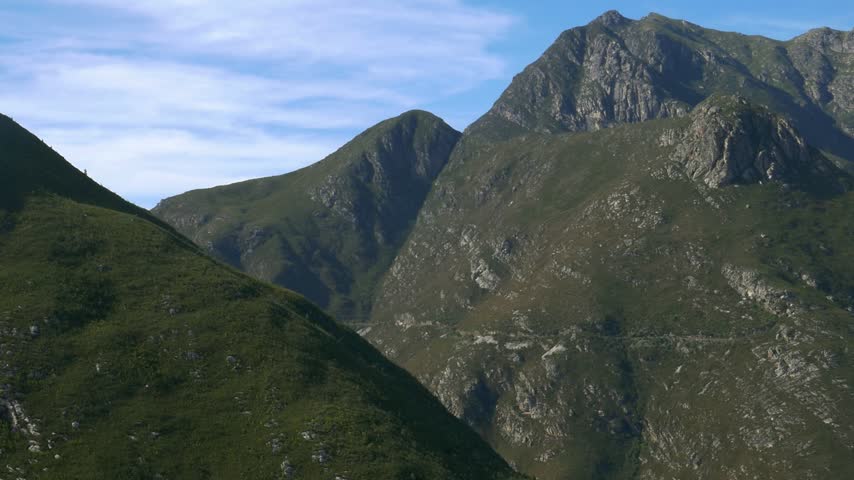 The rugged peaks of the Outeniqua Mountain Range rise above the landscape near George on South Africa’s Garden Route, Western Cape. Scenic mountain scenery showing the region’s natural beauty.