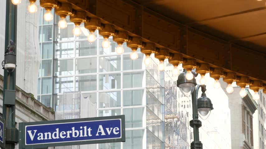 Grand Central Terminal on East 42 street, New York City Manhattan Midtown. Railway building entrance in United States. American public railroad transport. Vanderbilt avenue road sign and light bulbs.