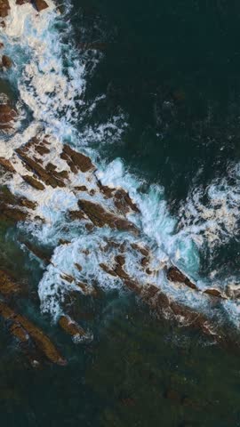 Ocean waves crashing on the rocky coastline of the indian ocean in sri lanka.