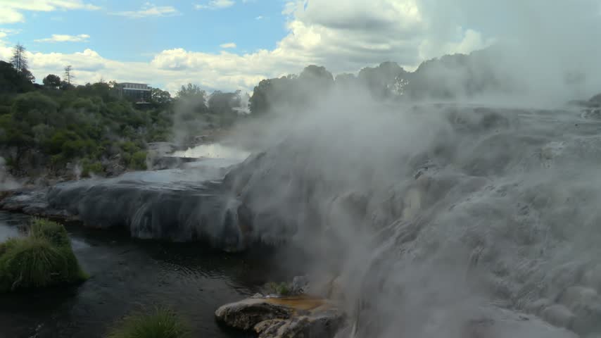 Steaming Geothermal Terraces and Flowing Water at Pohutu Geyser Rotorua New Zealand. Close Up Static Shot from Viewpoint