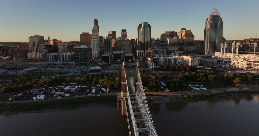 Aerial view of the Cincinnati skyline and the John A. Roebling Suspension Bridge spanning the Ohio River at sunset, Cincinnati, Ohio, United States.