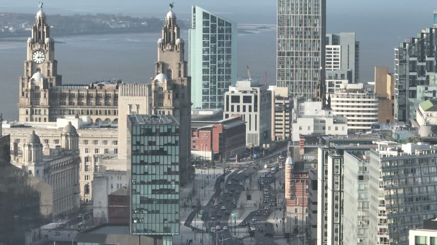Historic and modern office buildings beside Liverpool waterfront streets in Liverpool England United Kingdom